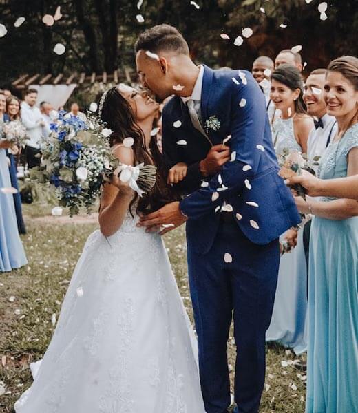 Couple kissing at a wedding